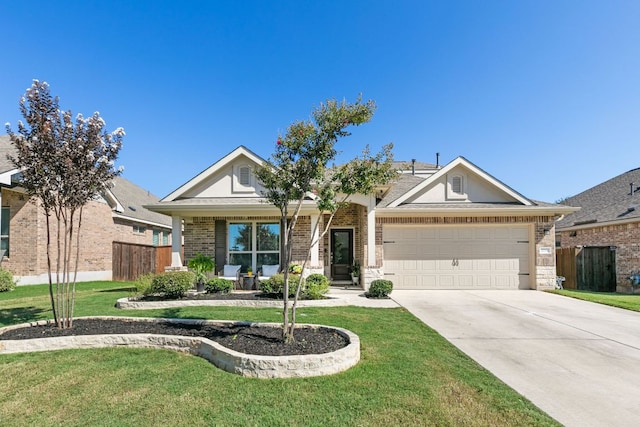 craftsman-style home featuring brick siding, a garage, driveway, and a front lawn