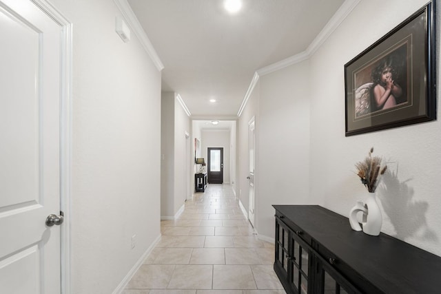 hallway featuring light tile patterned floors, baseboards, crown molding, and recessed lighting