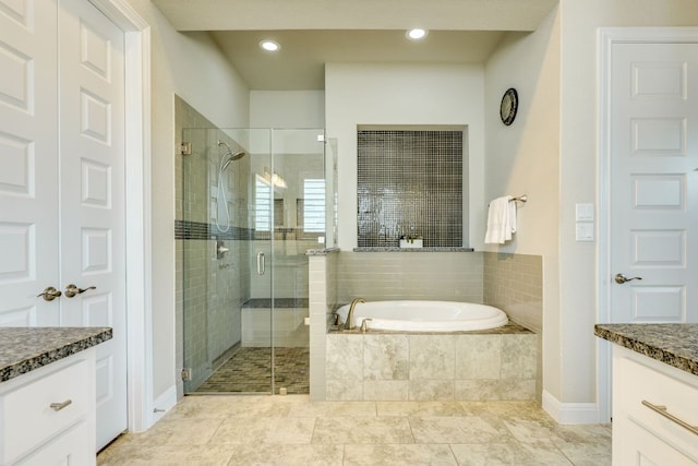 207 Vista Village Cv, Lakeway, TX 78738 - full bathroom featuring vanity, a garden tub, a stall shower, tile patterned flooring, and recessed lighting