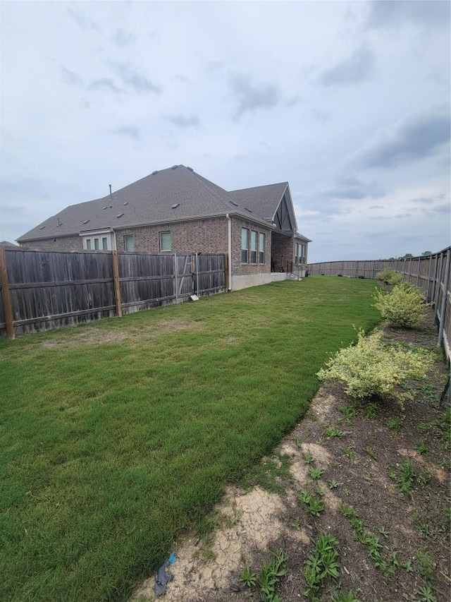 view of yard featuring a fenced backyard