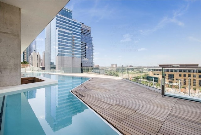 view of pool with a city view