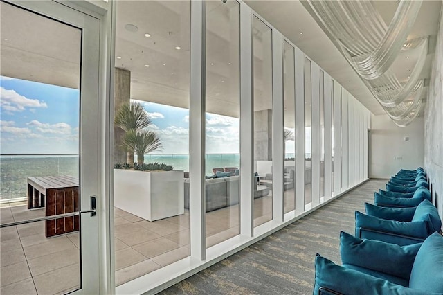 doorway to outside featuring a water view