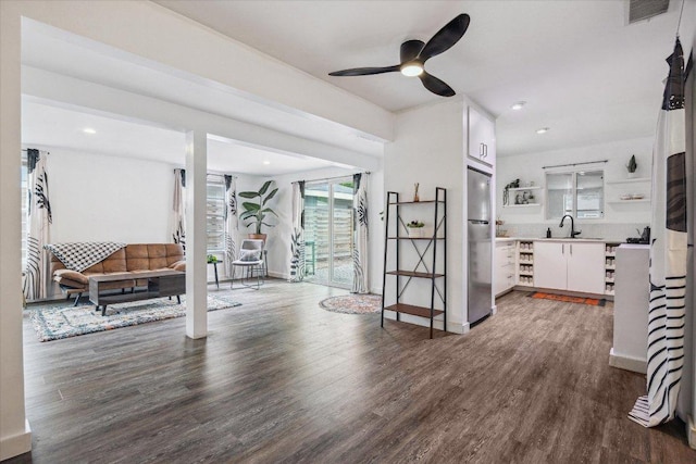 living room featuring recessed lighting, ceiling fan, visible vents, and wood finished floors