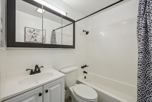 bathroom with vanity, shower / tub combo with curtain, toilet, tile walls, and tasteful backsplash