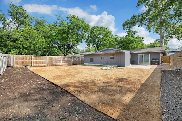 view of yard with a fenced backyard and a patio area