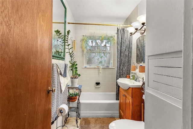 607 Gilmore St, Taylor, TX 76574 - bathroom with vanity, shower / tub combo, and toilet