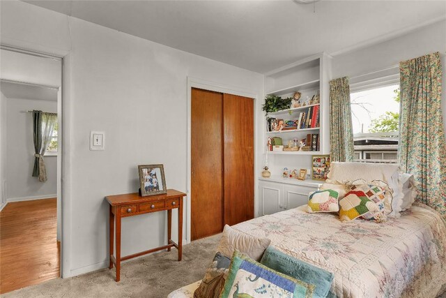 607 Gilmore St, Taylor, TX 76574 - bedroom with carpet flooring, baseboards, and a closet