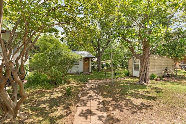 607 Gilmore St, Taylor, TX 76574 - view of yard featuring an outdoor structure and a shed