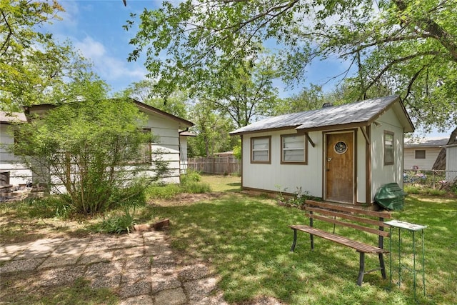 607 Gilmore St, Taylor, TX 76574 - view of outbuilding featuring fence and an outdoor structure
