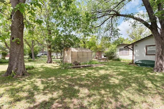 607 Gilmore St, Taylor, TX 76574 - view of yard with an outdoor structure and a shed