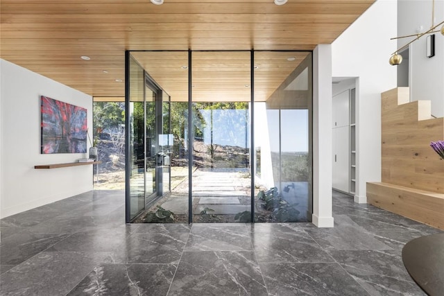 2405 Deer Pass, Austin, TX 78746 - doorway featuring recessed lighting, marble finish floor, floor to ceiling windows, and wooden ceiling