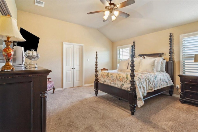 bedroom with baseboards, visible vents, light carpet, and vaulted ceiling