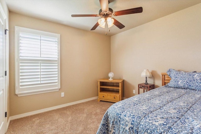 bedroom featuring carpet floors, baseboards, and ceiling fan