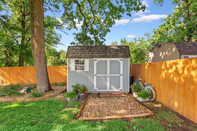 view of shed featuring a fenced backyard
