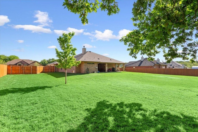 view of yard featuring a fenced backyard