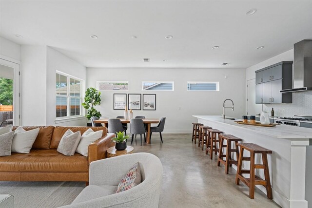5510 Woodrow Ave Unit 1, Austin, TX 78756 - living room featuring recessed lighting, baseboards, and finished concrete floors