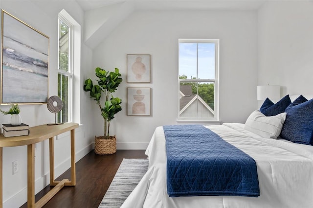 5510 Woodrow Ave Unit 1, Austin, TX 78756 - bedroom with dark wood-type flooring, baseboards, and vaulted ceiling