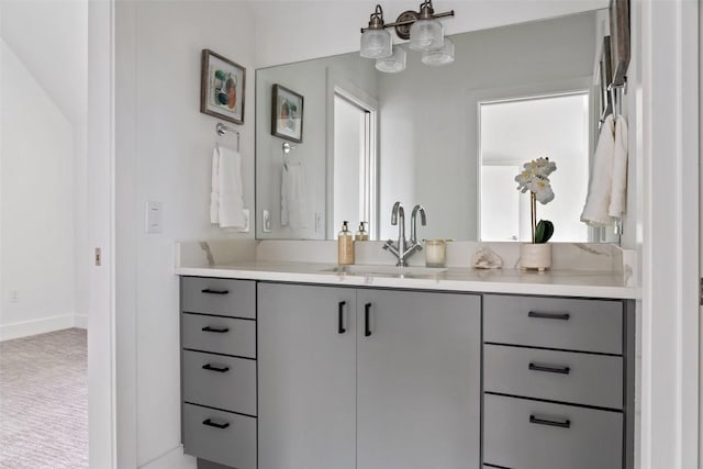 5510 Woodrow Ave Unit 1, Austin, TX 78756 - bathroom featuring baseboards, a chandelier, and vanity