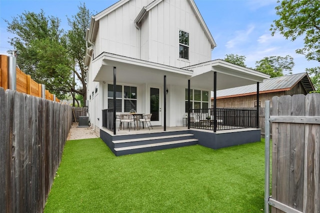5510 Woodrow Ave Unit 1, Austin, TX 78756 - back of house featuring board and batten siding, a yard, cooling unit, and a fenced backyard