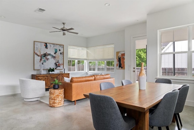 5510 Woodrow Ave Unit 1, Austin, TX 78756 - dining space featuring baseboards, a ceiling fan, finished concrete flooring, and a healthy amount of sunlight