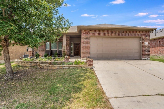 182 Lone Tree Holw, Buda, TX 78610 - view of front of house featuring brick siding, concrete driveway, an attached garage, and central AC unit