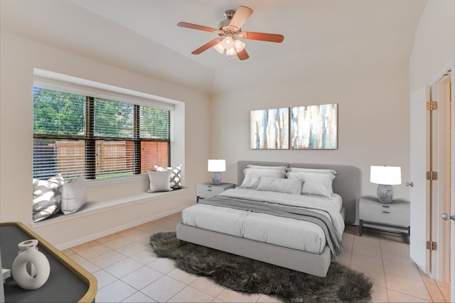 182 Lone Tree Holw, Buda, TX 78610 - bedroom featuring light tile patterned flooring, vaulted ceiling, and ceiling fan