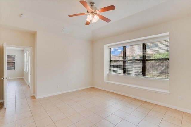 182 Lone Tree Holw, Buda, TX 78610 - unfurnished room with ceiling fan, light tile patterned floors, a smoke detector, lofted ceiling, and baseboards