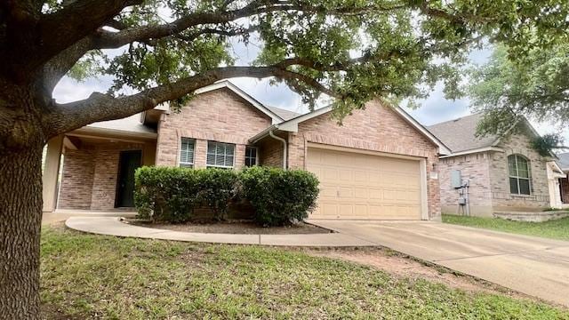 1616 Bowerton Dr, Austin, TX 78754 - ranch-style house featuring a garage, driveway, and brick siding