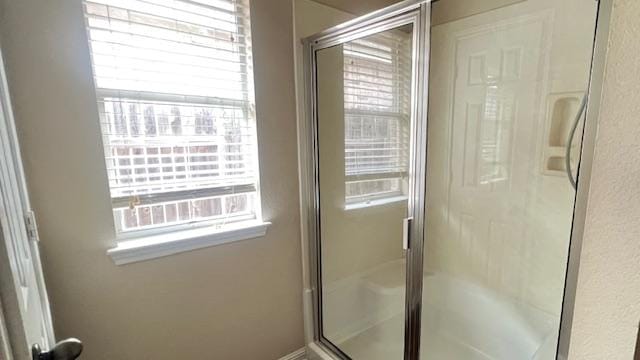 full bath featuring a shower stall