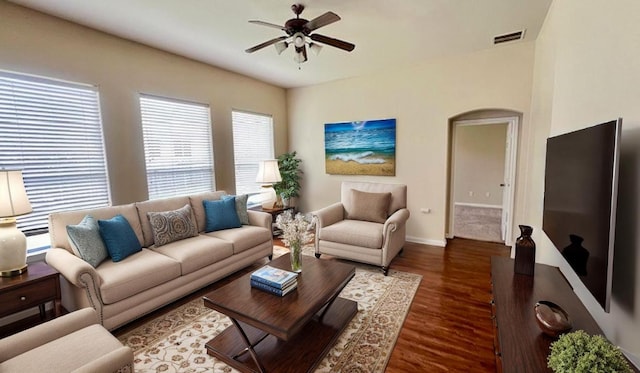 1616 Bowerton Dr, Austin, TX 78754 - living room with a ceiling fan, wood finished floors, and arched walkways