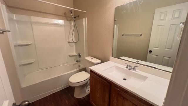 1616 Bowerton Dr, Austin, TX 78754 - full bathroom featuring wood finished floors, vanity, and bathtub / shower combination