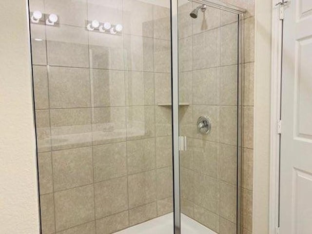bathroom featuring a stall shower