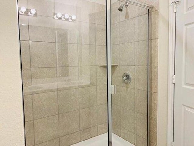 241 Cascata Way, Liberty Hill, TX 78642 - full bathroom featuring a shower stall