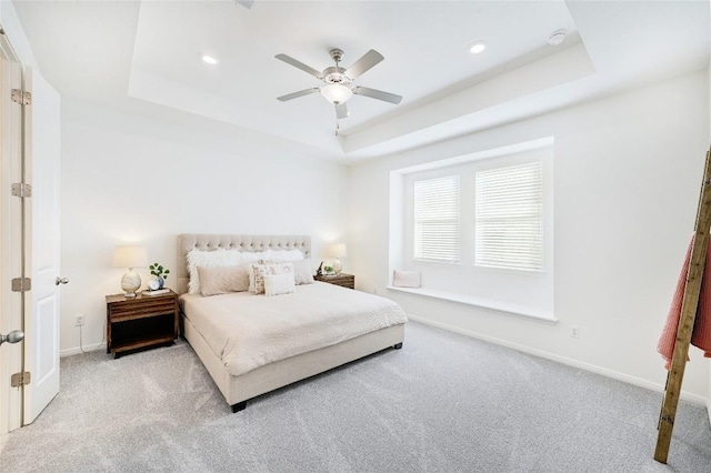 19020 Fernando Trl, Austin, TX 78738 - bedroom featuring light colored carpet, a tray ceiling, baseboards, recessed lighting, and ceiling fan