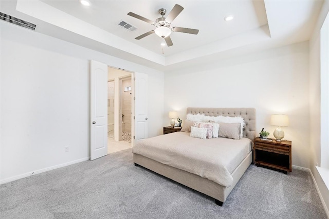 19020 Fernando Trl, Austin, TX 78738 - carpeted bedroom with a raised ceiling, recessed lighting, baseboards, ceiling fan, and ensuite bath