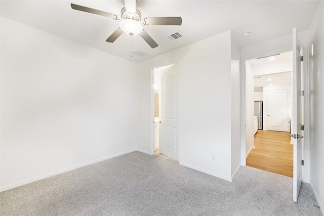 19020 Fernando Trl, Austin, TX 78738 - unfurnished bedroom with carpet flooring, baseboards, and a ceiling fan