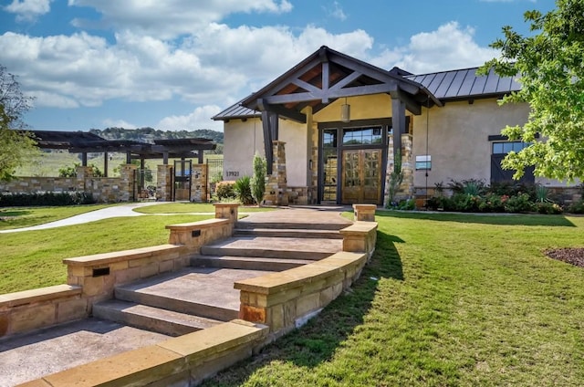 19020 Fernando Trl, Austin, TX 78738 - view of front facade with a standing seam roof, french doors, stucco siding, a pergola, and a front lawn