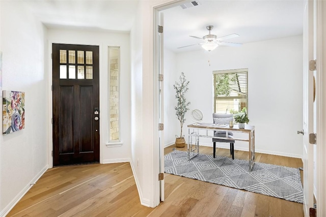 19020 Fernando Trl, Austin, TX 78738 - entryway with light wood-style floors, ceiling fan, and baseboards