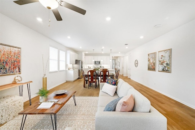19020 Fernando Trl, Austin, TX 78738 - living area featuring light wood-style floors, baseboards, ceiling fan, and recessed lighting