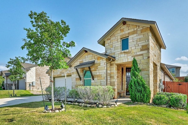 19020 Fernando Trl, Austin, TX 78738 - view of front facade with stone siding, driveway, and a garage