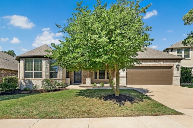 10408 Nicolet Way, Austin, TX 78717 - view of front of home featuring an attached garage, driveway, a front yard, and brick siding
