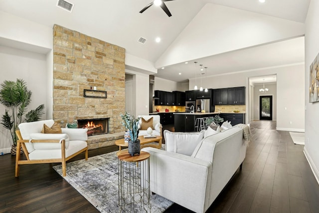 10408 Nicolet Way, Austin, TX 78717 - living area featuring a stone fireplace, high vaulted ceiling, baseboards, dark wood finished floors, and ceiling fan