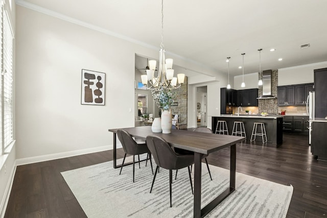 10408 Nicolet Way, Austin, TX 78717 - dining space featuring a chandelier, recessed lighting, dark wood finished floors, and ornamental molding