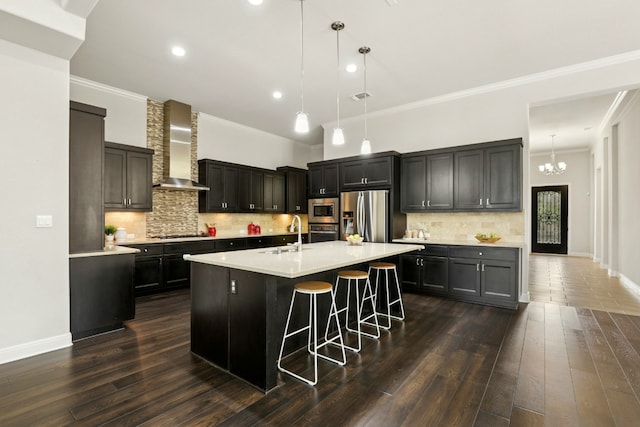 10408 Nicolet Way, Austin, TX 78717 - kitchen with wall chimney exhaust hood, appliances with stainless steel finishes, a sink, light countertops, and recessed lighting