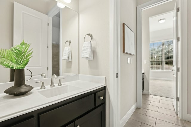10408 Nicolet Way, Austin, TX 78717 - bathroom with vanity, tile patterned flooring, and baseboards