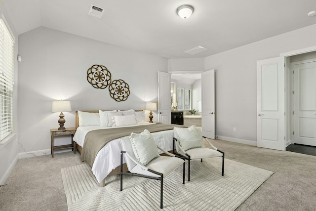 10408 Nicolet Way, Austin, TX 78717 - bedroom with light colored carpet, multiple windows, baseboards, and lofted ceiling