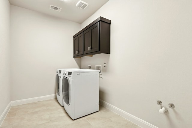 10408 Nicolet Way, Austin, TX 78717 - laundry room with baseboards, washing machine and dryer, and light tile patterned floors
