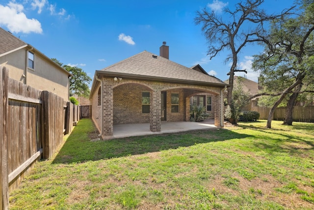 10408 Nicolet Way, Austin, TX 78717 - rear view of property featuring brick siding, a chimney, a patio area, and roof with shingles