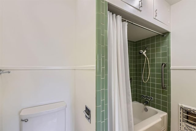 full bath with heating unit, toilet, and shower / tub combo with curtain