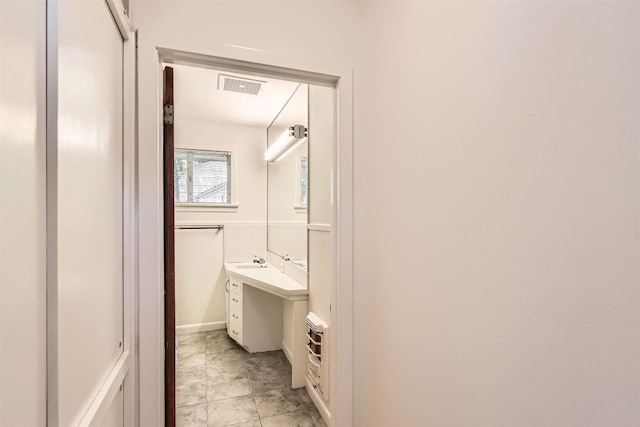 bathroom featuring visible vents and vanity